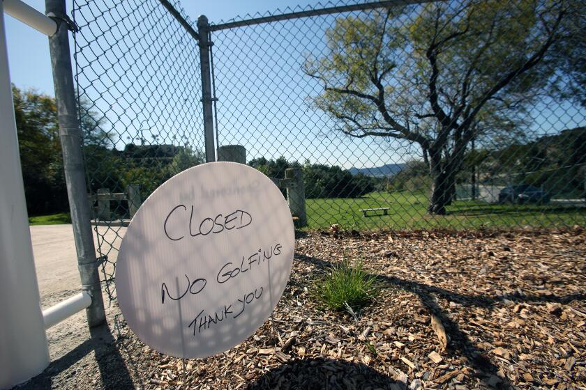 A sign noting DeBell Golf Club being closed, implying the closure is due to coronavirus, in Burbank on Thursday, March 25, 2020. Both the course and driving range are closed. People of Burbank as well as most in the country, with parks, golf courses, tennis clubs, trails, and entertainment venues being closed, are finding their own way to keep fit.