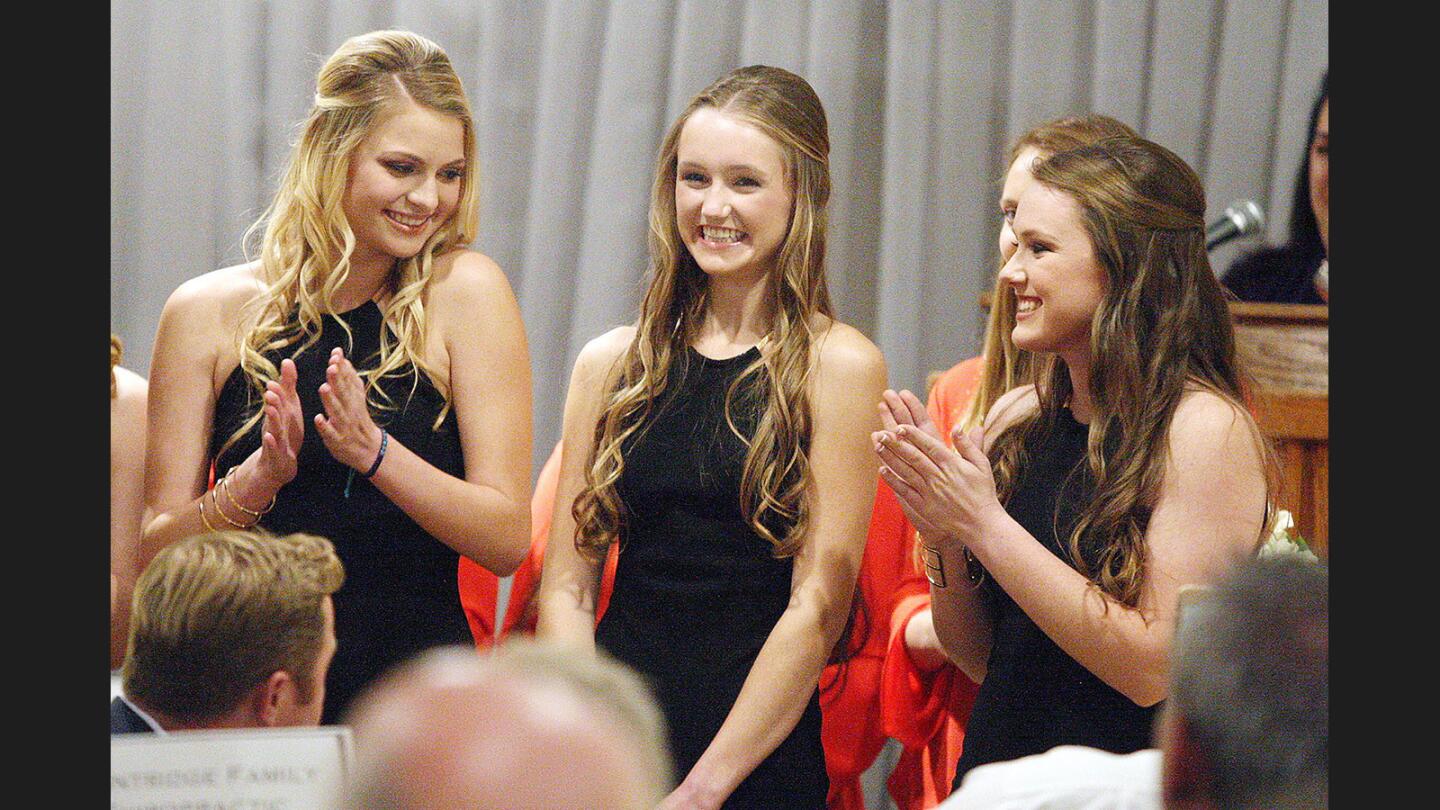 Sarah Ann Settles, center, smiles big after being named the 2017 Miss La Cañada Flintridge, flanked by court members Reagan Meyer and Holly Stoner at the La Cañada Flintridge Country Club for the La Cañada Chamber of Commerce and Community Association installation dinner, awards ceremony and the naming/crowning of Miss La Canada Flintridge on Thursday, January 26, 2017. The 2017 Miss La Cañada Flintridge is Sarah Ann Settles.