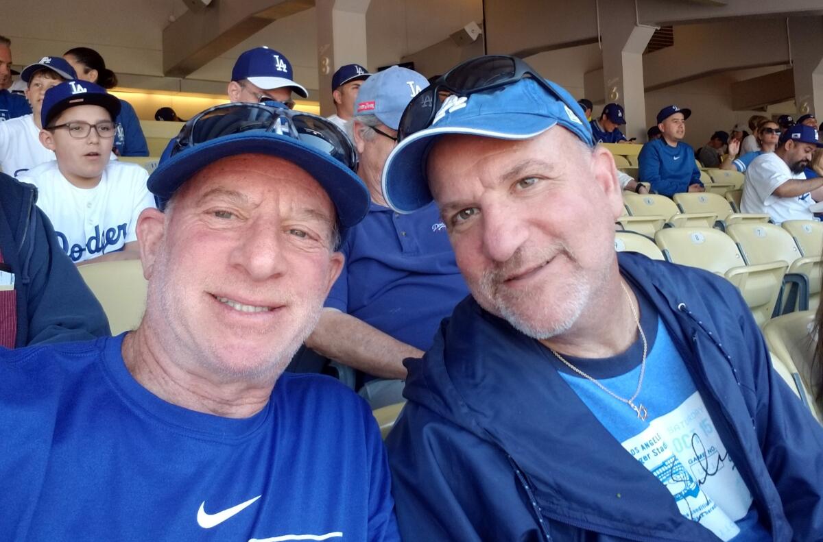 Ross Miller and his brother attend the Dodgers' 2019 home opener.