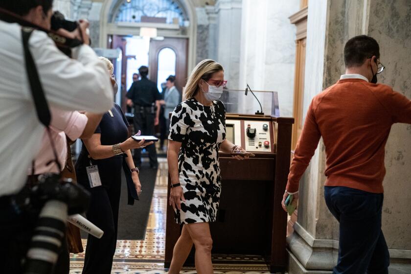 WASHINGTON, DC - SEPTEMBER 29: Sen. Kyrsten Sinema (D-AZ) arrives for a vote on the Senate side of the U.S. Capitol on Wednesday, Sept. 29, 2021 in Washington, DC. (Kent Nishimura / Los Angeles Times)