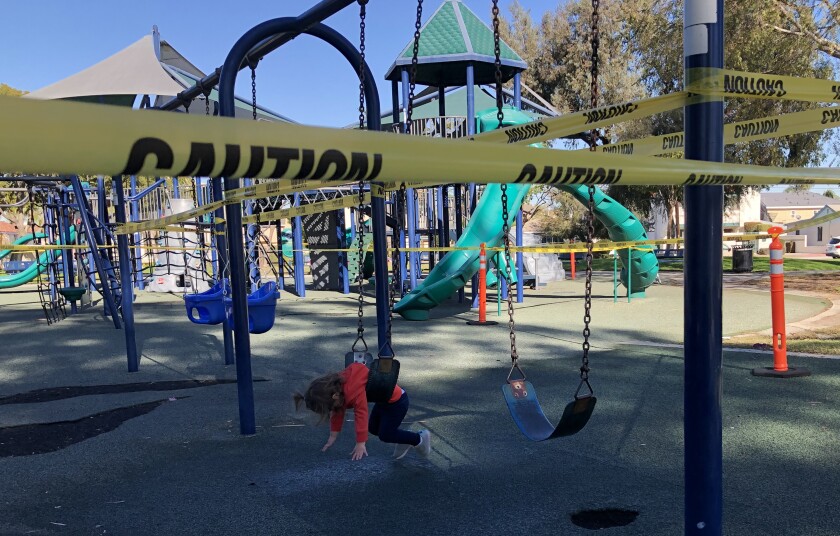 A little girl on a swing