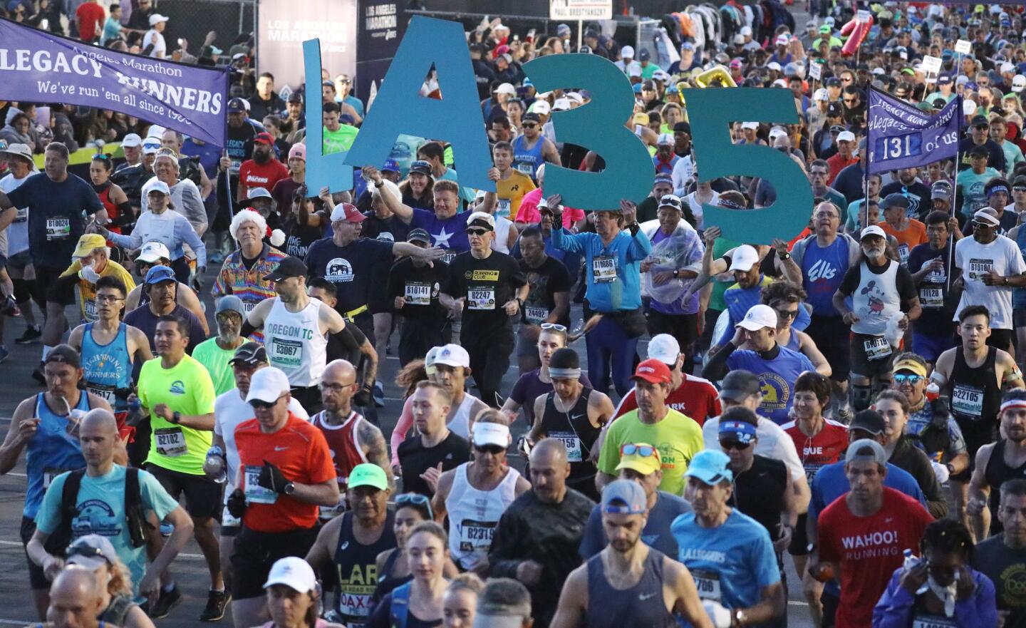 And they're off. Runners begin the 35th annual L.A. Marathon from Dodger Stadium on Sunday.