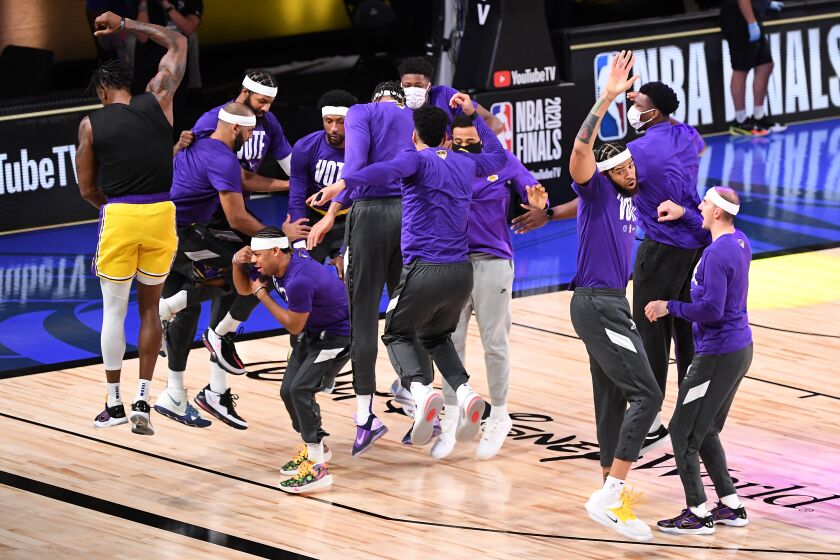 ORLANDO, FLORIDA SEPTEMBER 30, 2020-Laker players hype each other up before Game 1 of the NBA FInals aginst the Heat in Orlando Wednesday. (Wally Skalij/Los Angeles Times)