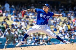 LOS ANGELES, CA - AUGUST 13, 2023: Los Angeles Dodgers starting pitcher Julio Urias (7) pitches.