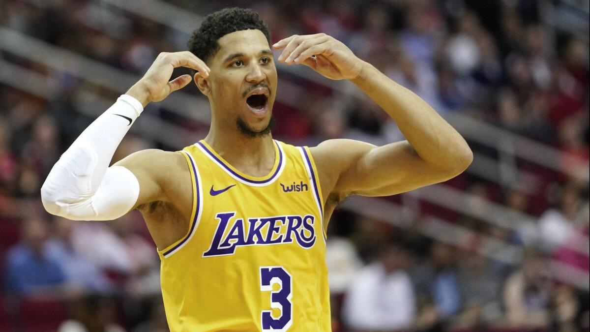 Josh Hart reacts after fouling Houston's James Harden.