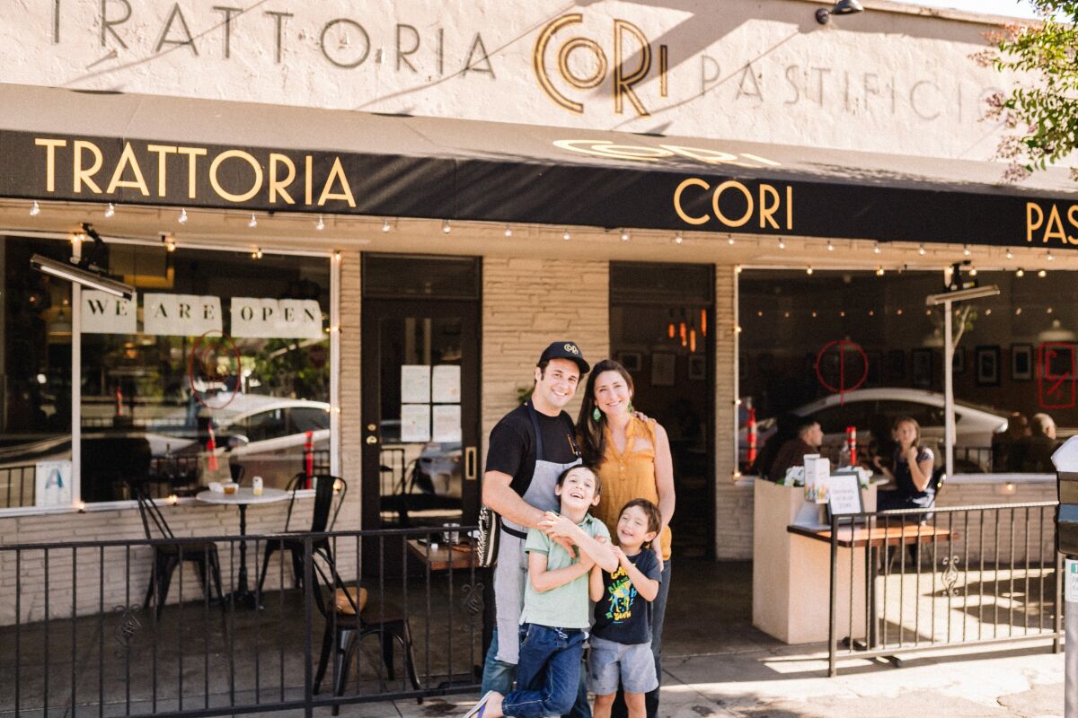 Chef Accursio Lota, his wife Corinne Goria and their sons at Cori Trattoria Pastificio restaurant in North Park.
