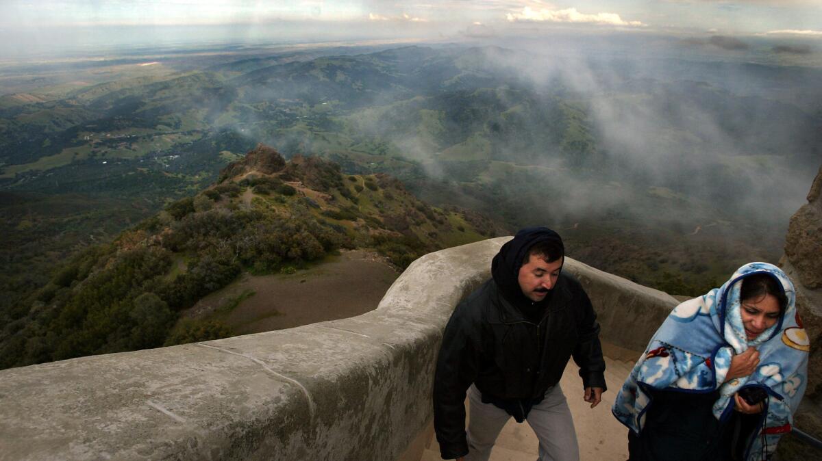 A couple makes their way up California's Mount Diablo, one of the key peaks used in the state's mapping.