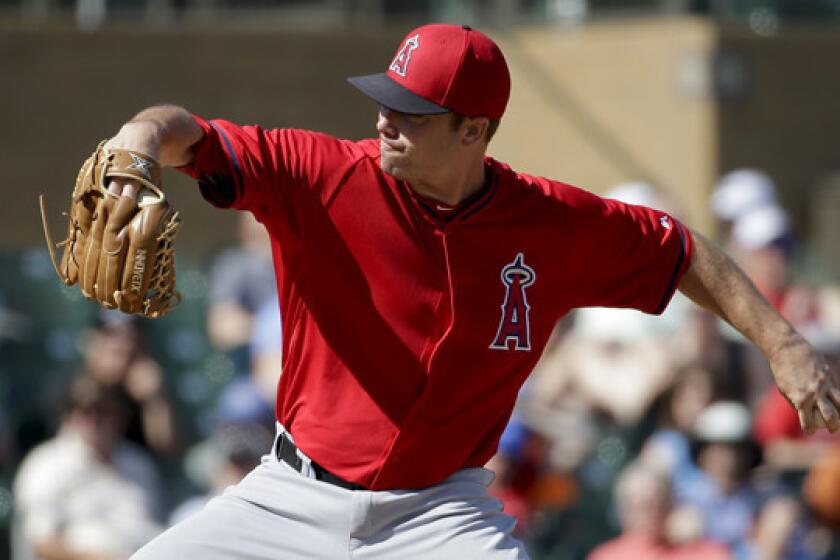 Angels reliever Sean Burnett throws during a spring training game against the Colorado Rockies on March 7.