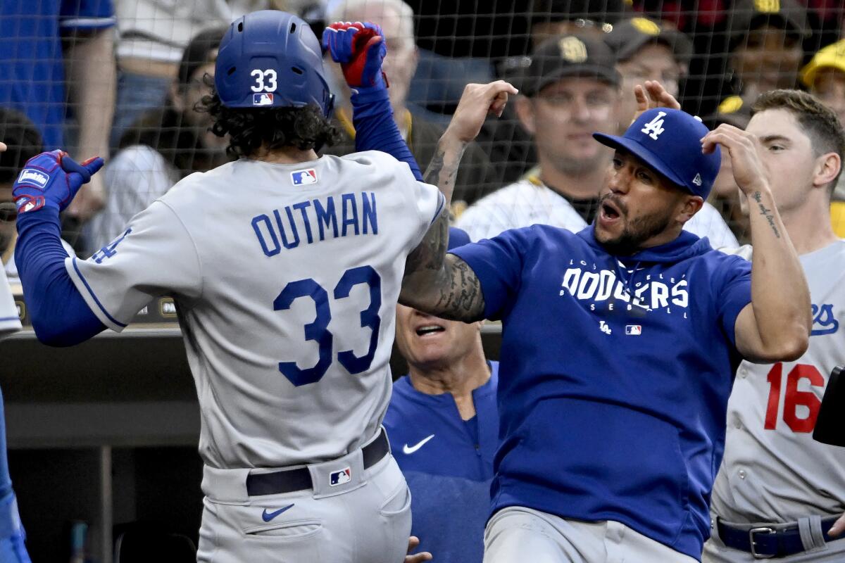 James Outman celebrates with Dodgers teammate David Peralta after hitting a two-run home run.