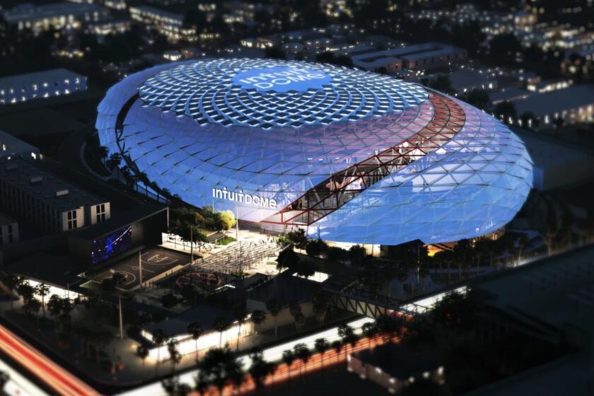 An artist’s rendering shows an aerial view of the Clippers’ news arena, The Intuit Dome, at night.
