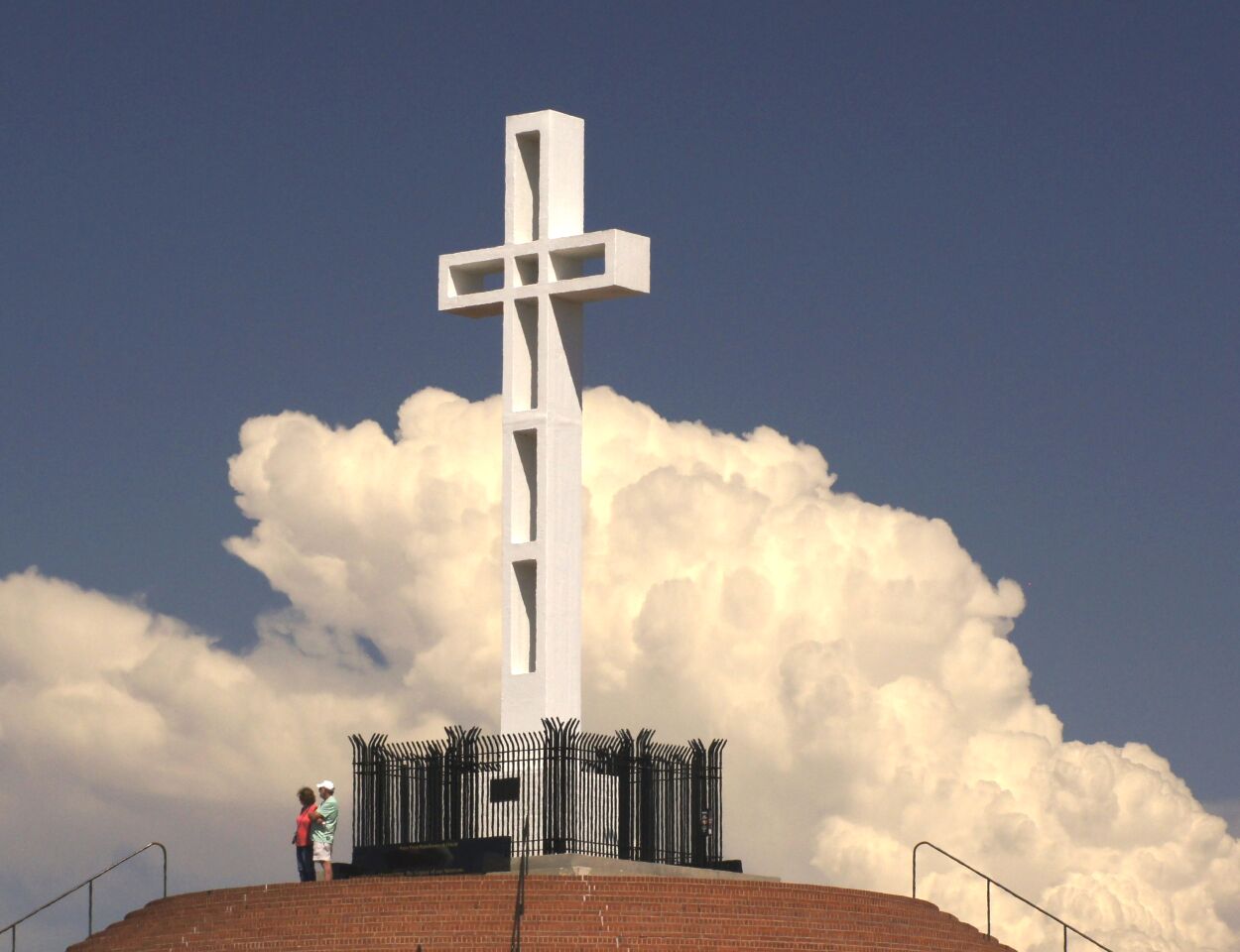 Billowing clouds provide the backdrop for the Mount Soledad National Veterans Memorial cross.