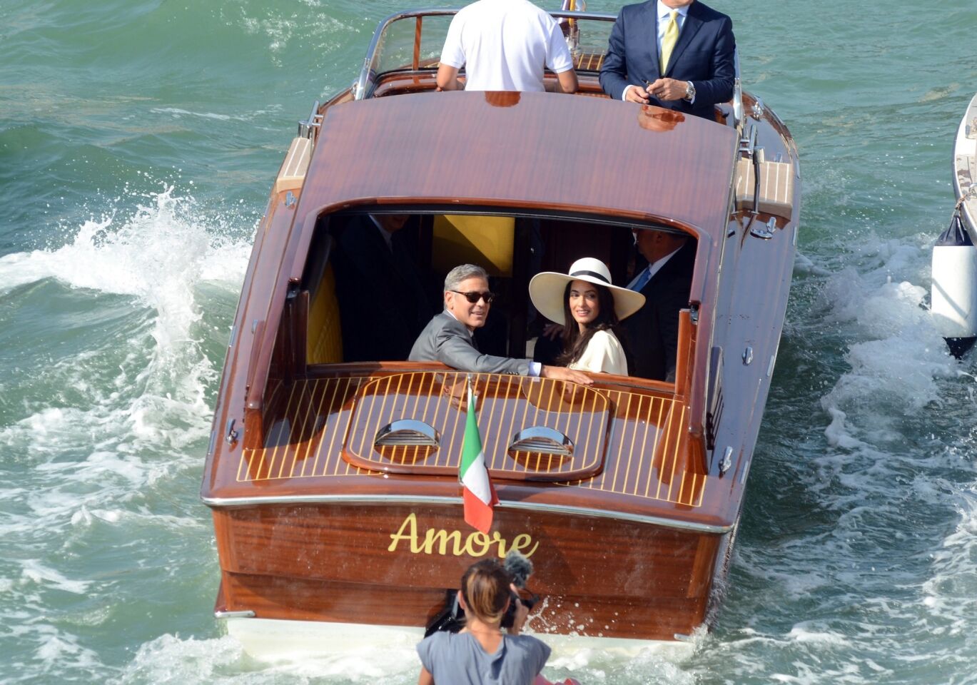 And they're off -- George Clooney and Amal Alamuddin headed for the airport Monday shortly after making their marriage legal at Venice's city hall.