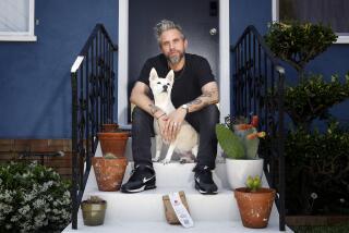 Richie Kulchar with an unwanted Uber Eats order and his dog Molly at home in Highland Park.
