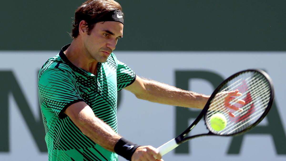 Roger Federer returns a shot to Jack Sock during the semifinals of the Paribas Open on Saturday.