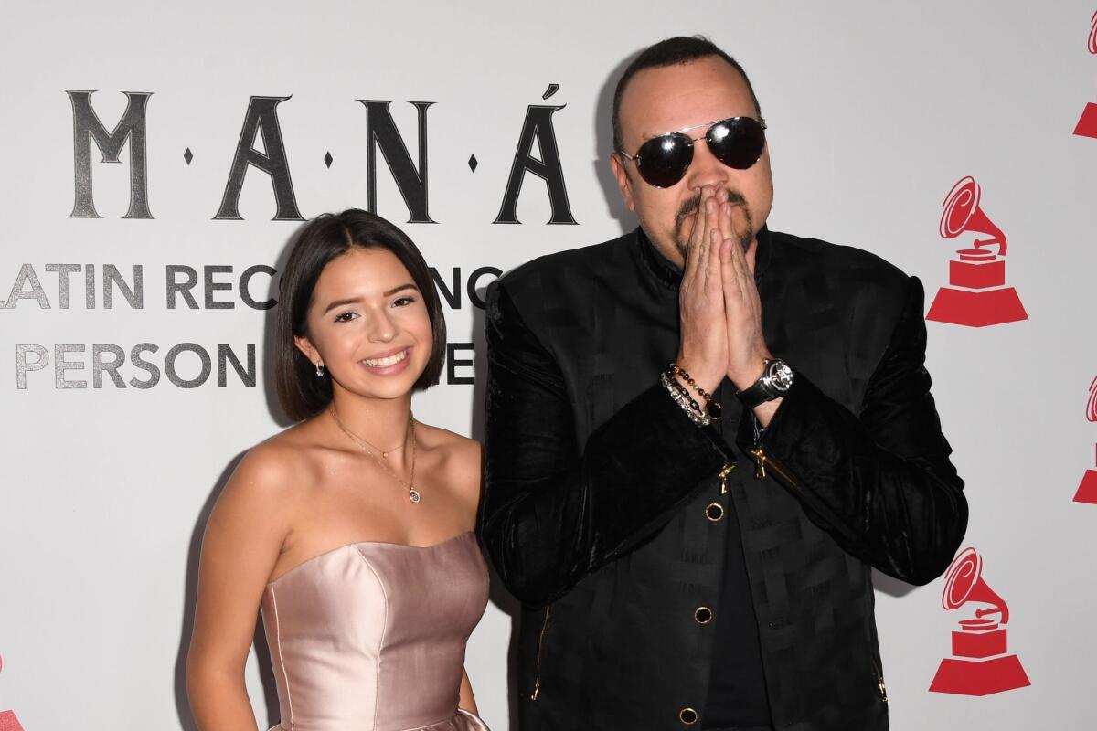 US-Mexican singer-songwriter Pepe Aguilar and his daughter US-Mexican singer Angela Aguilar arrive for the 2018 Latin Recording Academy Person of the Year gala, honoring Mexican rock band Mana, in Las Vegas, Nevada, on November 14, 2018. (Photo by Robyn BECK / AFP)ROBYN BECK/AFP/Getty Images ** OUTS - ELSENT, FPG, CM - OUTS * NM, PH, VA if sourced by CT, LA or MoD **