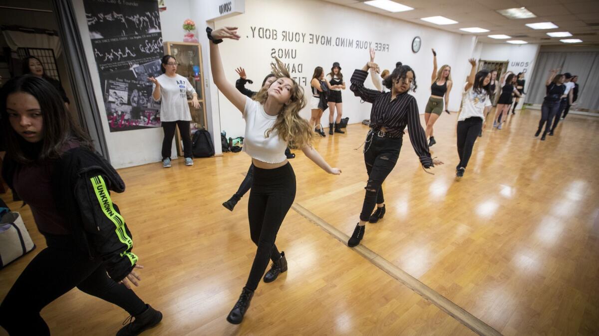 Dancers practice their moves during a K-Pop dance class that happens twice a week at Uno's Dance Fitness Center.