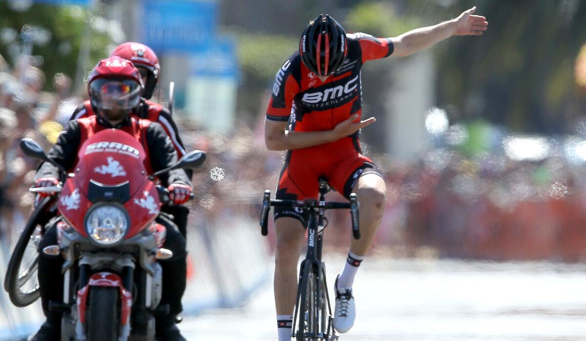 Taylor Phinney takes a bow atop his bicycle after winning the Tour of California's fifth stage on Thursday afternoon in Santa Barbara.