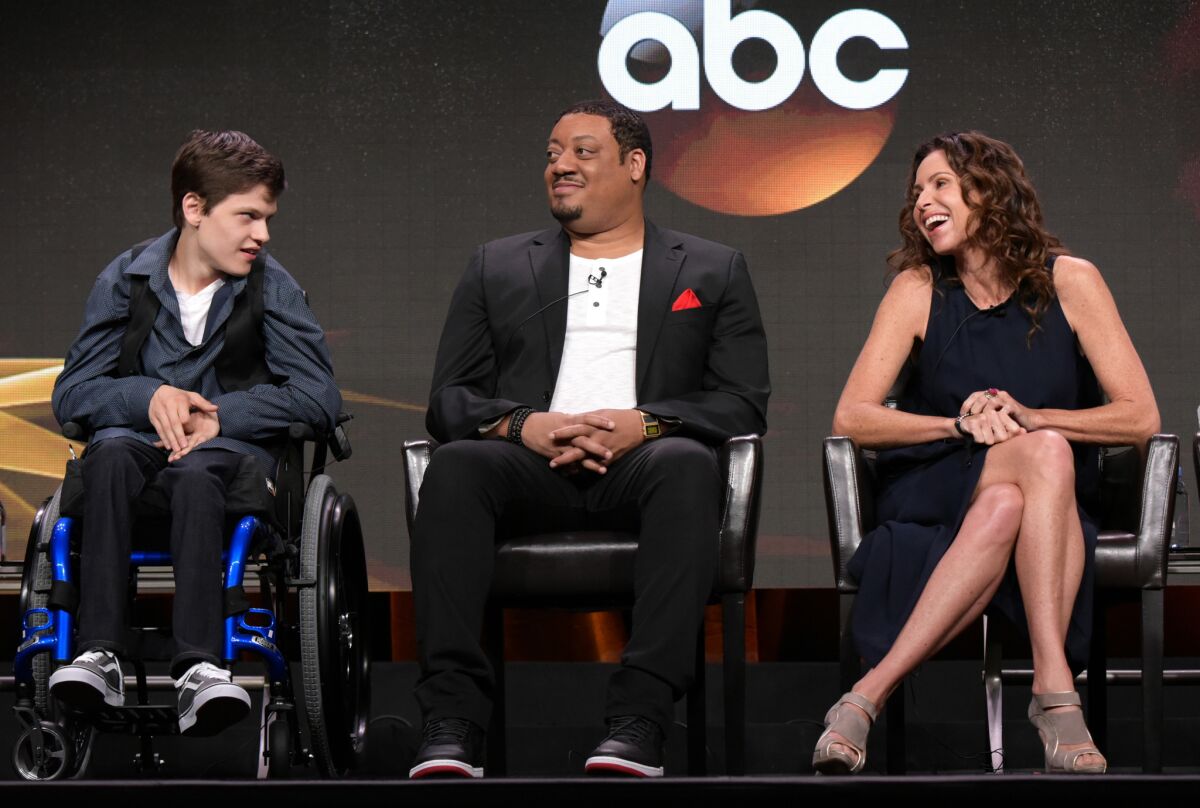 Micah Fowler, left, Cedric Yarbrough and Minnie Driver participate in the "Speechless" panel at the Television Critics Assn. summer press tour in Beverly Hills.
