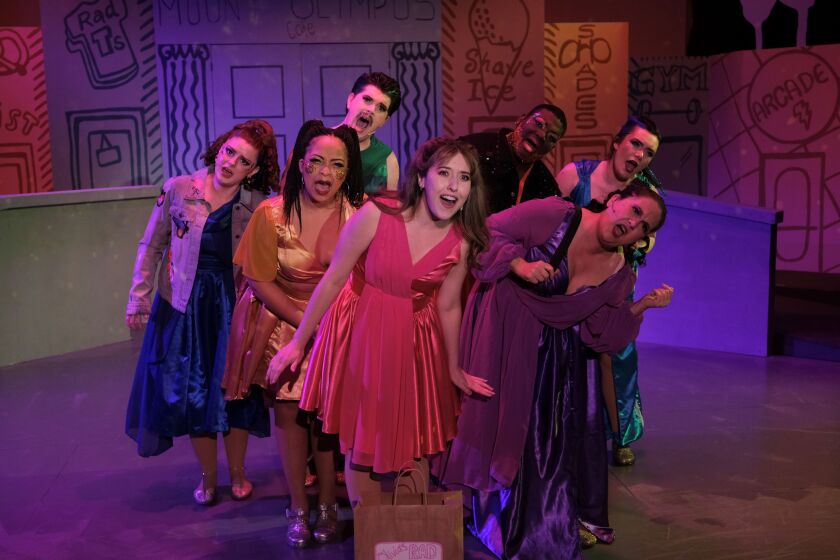 Krista Feallock, center, leads the family of Greek muses in San Diego Musical Theatre's "Xanadu."