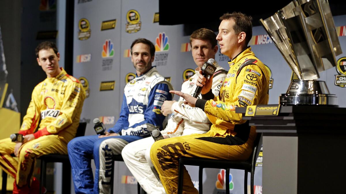 Kyle Busch, right, talks to reporters alongside fellow NASCAR drivers, from left, Joey Logano, Jimmie Johnson and Carl Edwards during a news conference Thursday.
