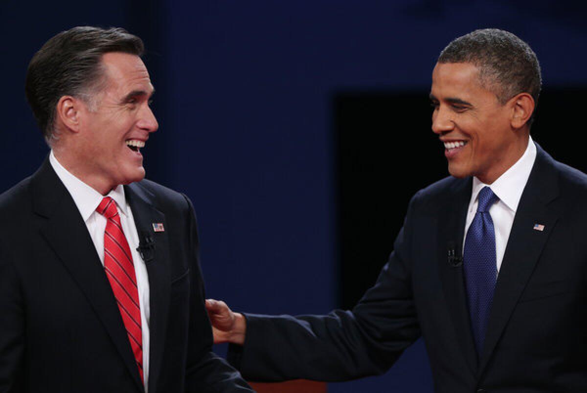 Mitt Romney and President Obama after Wednesday's presidential debate at the University of Denver.