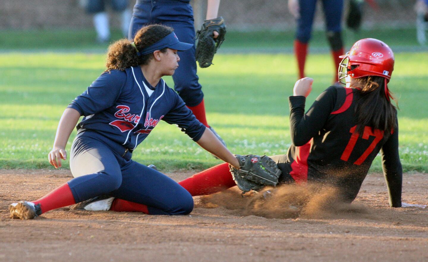 Burbank All-Stars' Chloe Bookmeyer tags Foothill All-Stars' Ashley Hernandez out at second base in a steal attempt in a Little League majors softball tournament game at Scholl Canyon Fields in Glendale on Wednesday, June 25, 2014. (Tim Berger/Staff Photographer)
