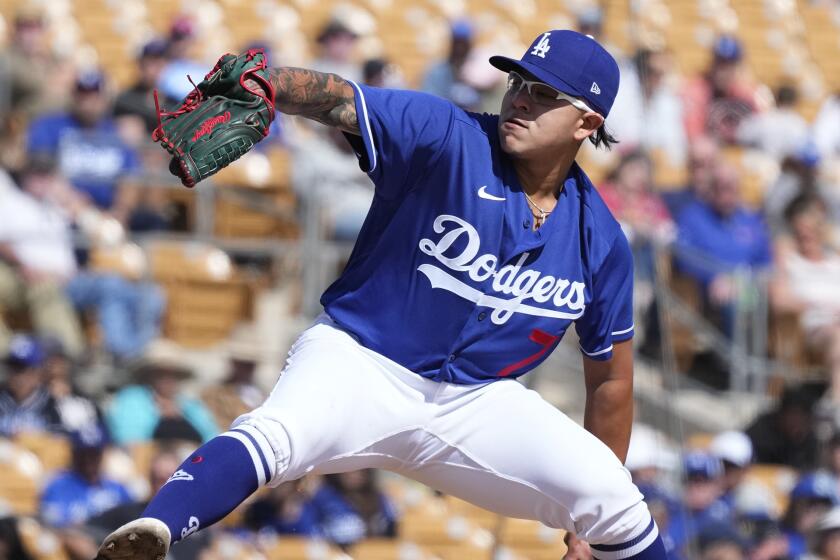 Los Angeles Dodgers starting pitcher Julio Urias throws a pitch against the Cincinnati Reds.