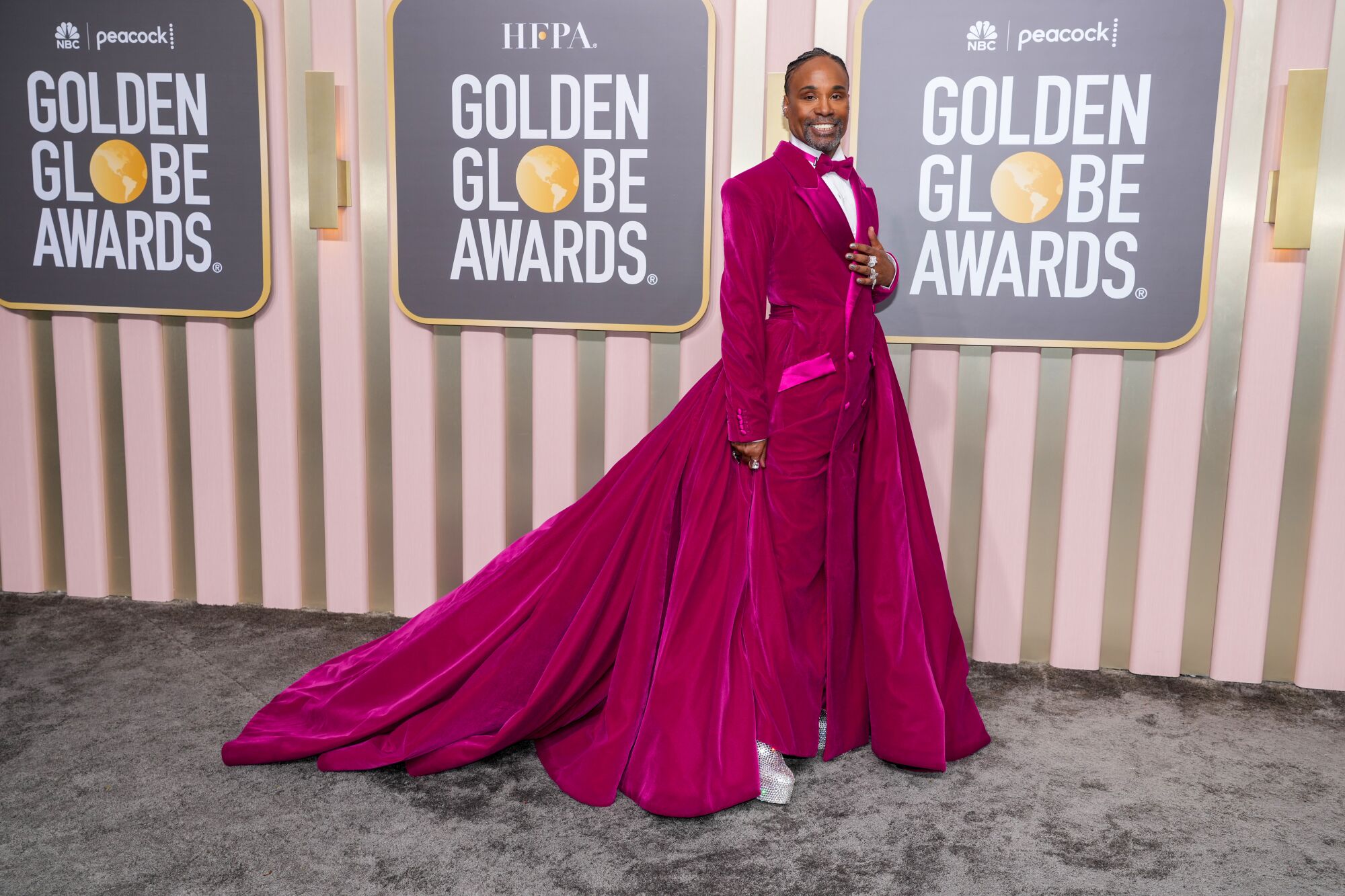 Billy Porter shuts down the Golden Globes red carpet in a fuchsia velvet tuxedo gown.