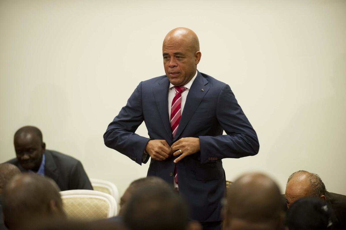 In Haiti, large, angry crowds have gathered regularly to express their dissatisfaction with President Michel Martelly, above.