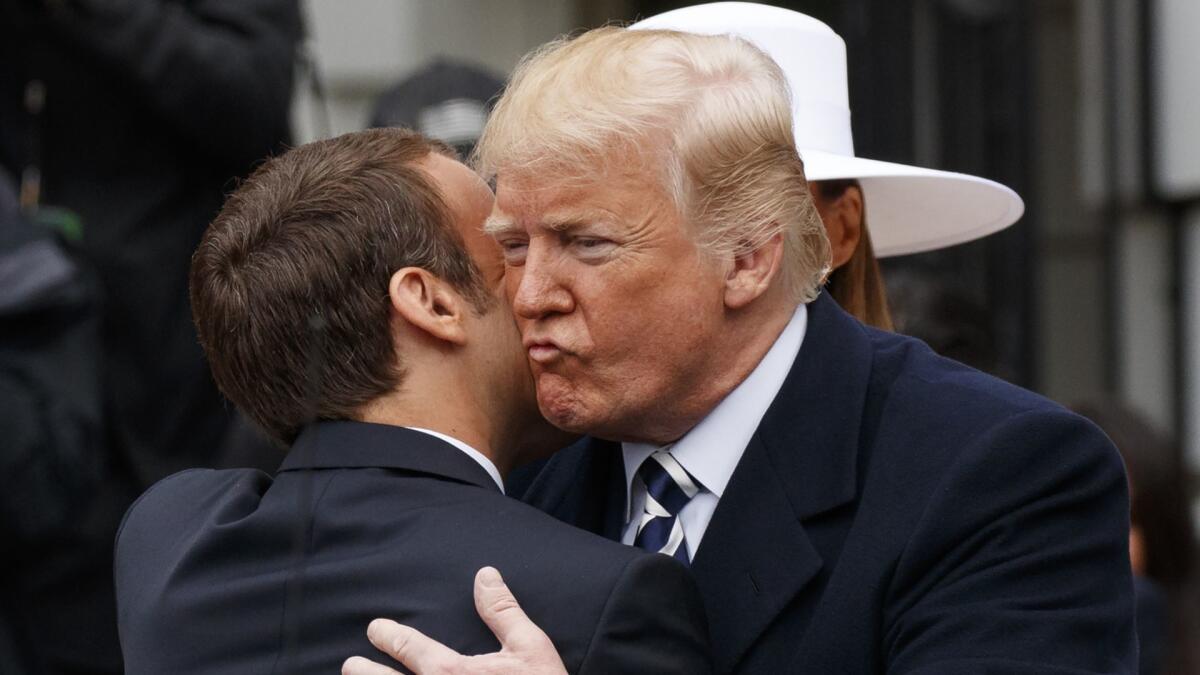 President Trump greets French President Emmanuel Macron as he arrives for a State Arrival Ceremony on the South Lawn of the White House on April 24.