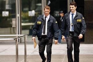 FBI agents leave the downtown headquarters of the Los Angeles Department of Water and Power in 2019.
