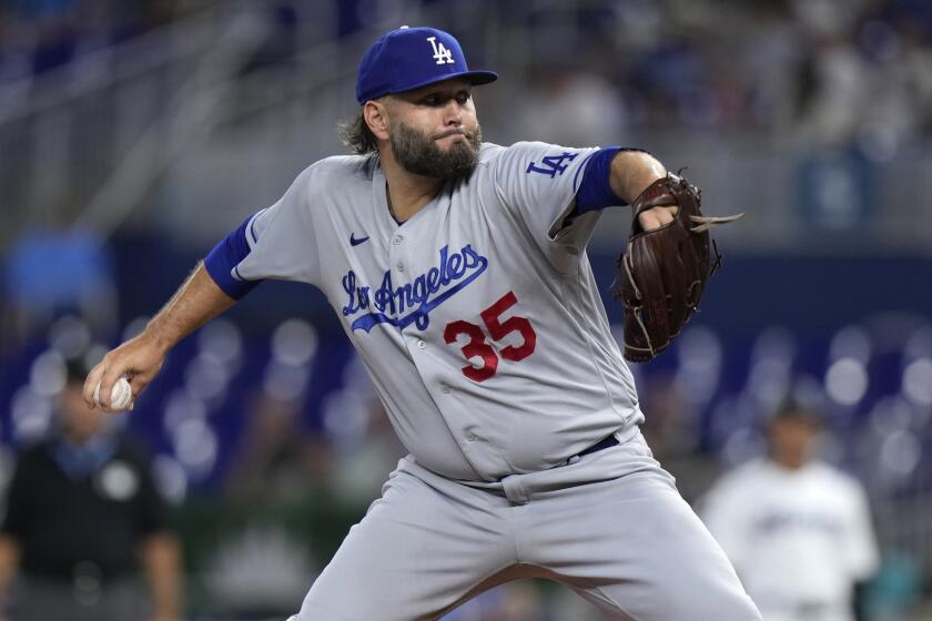 Los Angeles Dodgers' Lance Lynn delivers a pitch during the first inning of a baseball game.