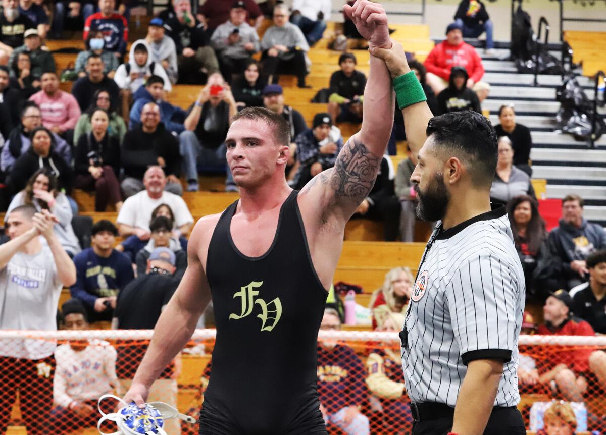 Fountain Valley's TJ McDonnell raises his hand in victory after the 182-pound final in the Mann Classic on Saturday.