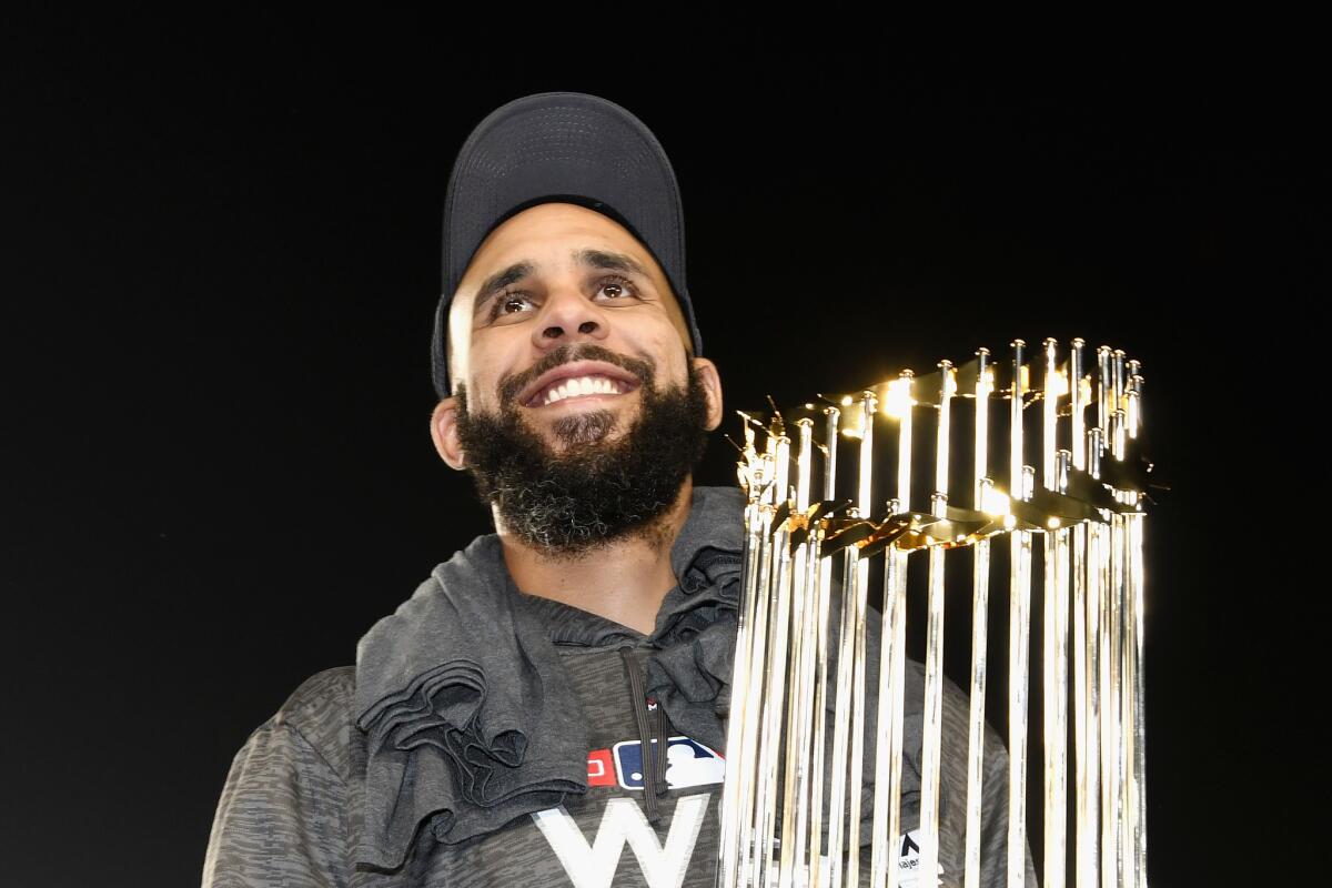 David Price #24 of the Boston Red Sox celebrates with the World Series trophy after his team's 5-1 win over the Los Angeles Dodgers in Game Five to win the 2018 World Series at Dodger Stadium on October 28, 2018 in Los Angeles, California.