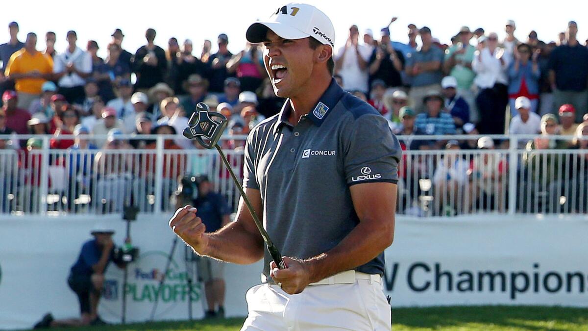 Jason Day celebrates after winning the BMW Championship on Sunday at Conway Farms Golf Club.