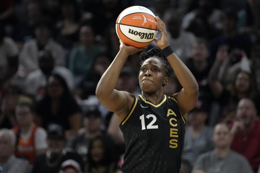 FILE -Las Vegas Aces guard Chelsea Gray (12) plays against the New York Liberty during Game 1 of a WNBA basketball final playoff series Sunday, Oct. 8, 2023, in Las Vegas. The Las Vegas Aces signed three-time WNBA Champion Chelsea Gray to a contract extension, Tuesday, April 30, 2024. (AP Photo/John Locher, File)