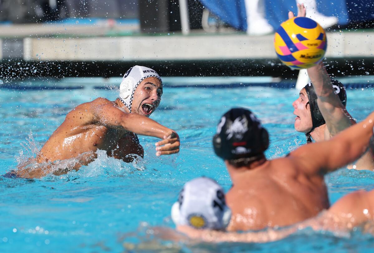 Marco Rizoff (9) of Newport Beach Water Polo Club shoots through traffic at the USA Water Polo Junior Olympics on Tuesday.