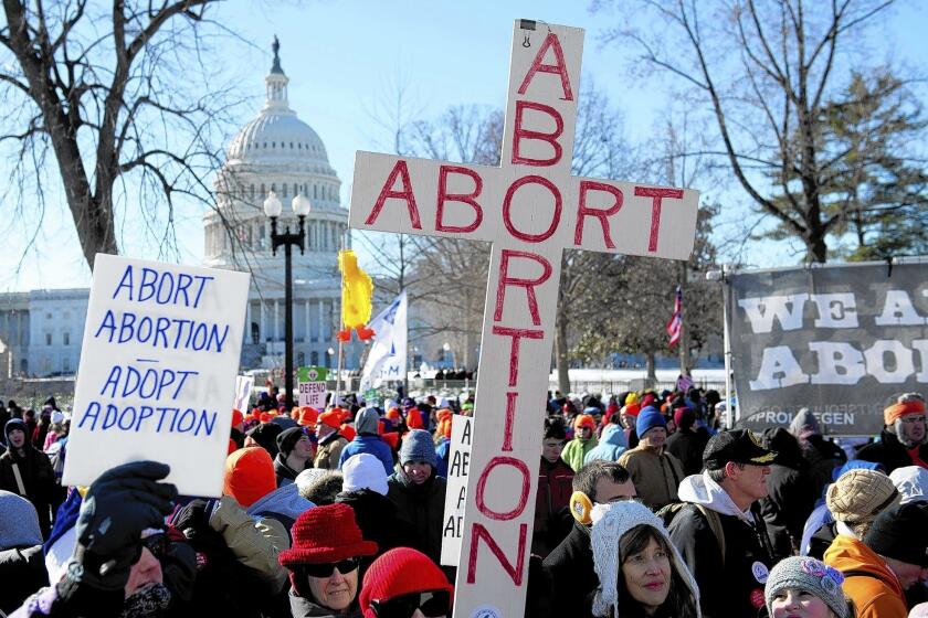 Antiabortion demonstrators protest in Washington. A case involving no-protest zones at abortion clinics is among the 1st Amendment issues brought by right-wing groups to the Supreme Court in its coming term.