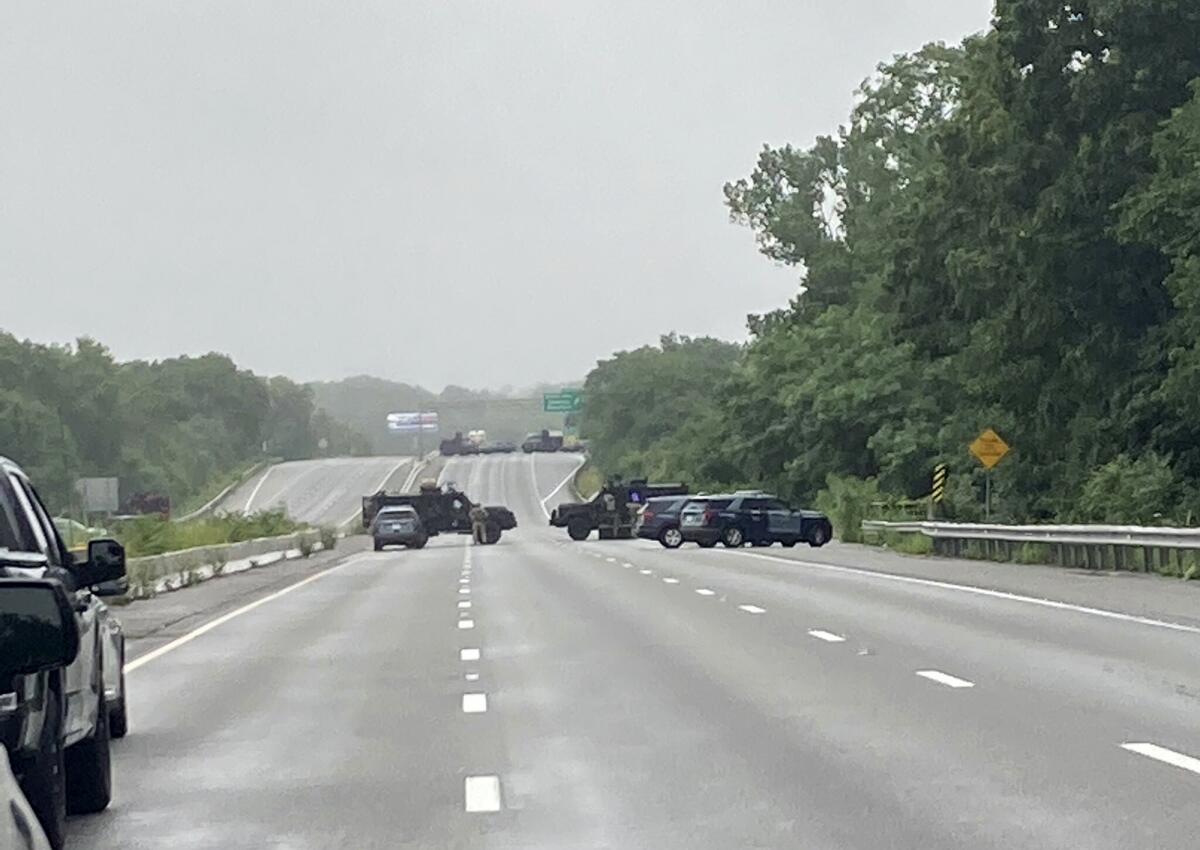 Massachusetts State Police shows police block off a section of Interstate 95 near Wakefield, Mass.