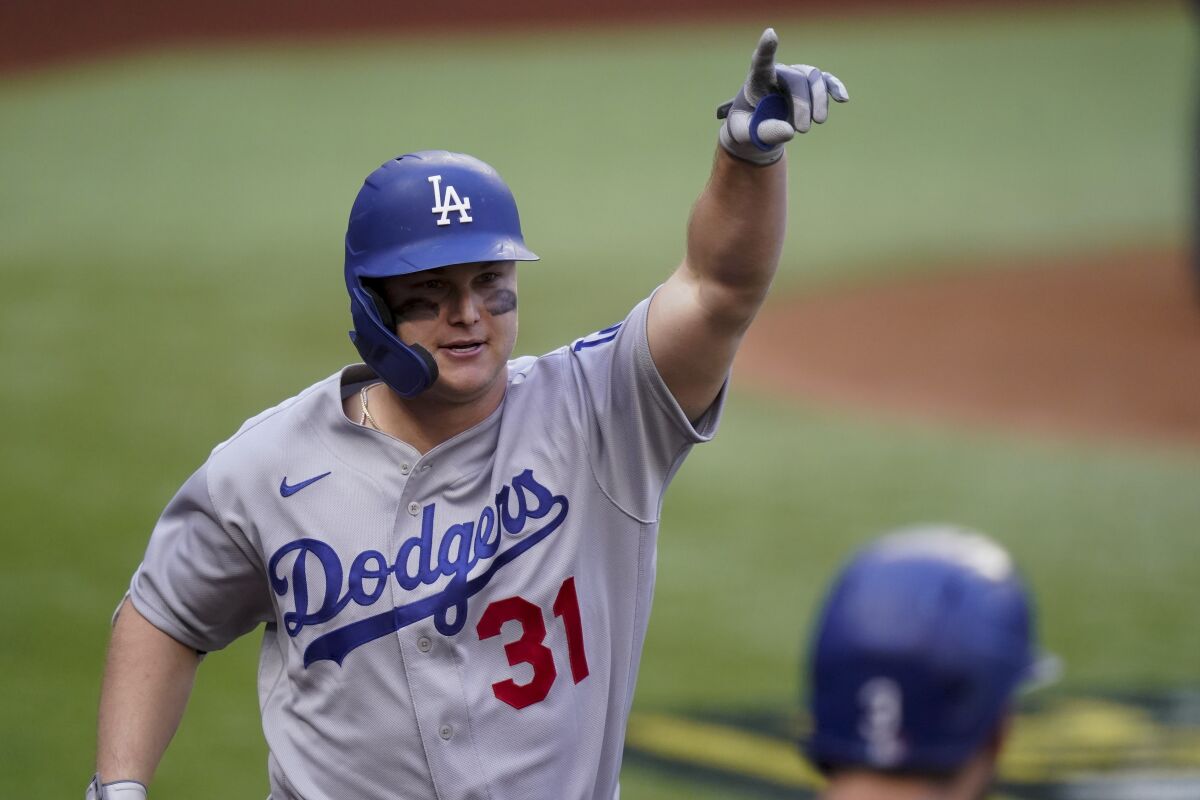 Joc Pederson celebrates a three-run home run during the first inning of Game 3.