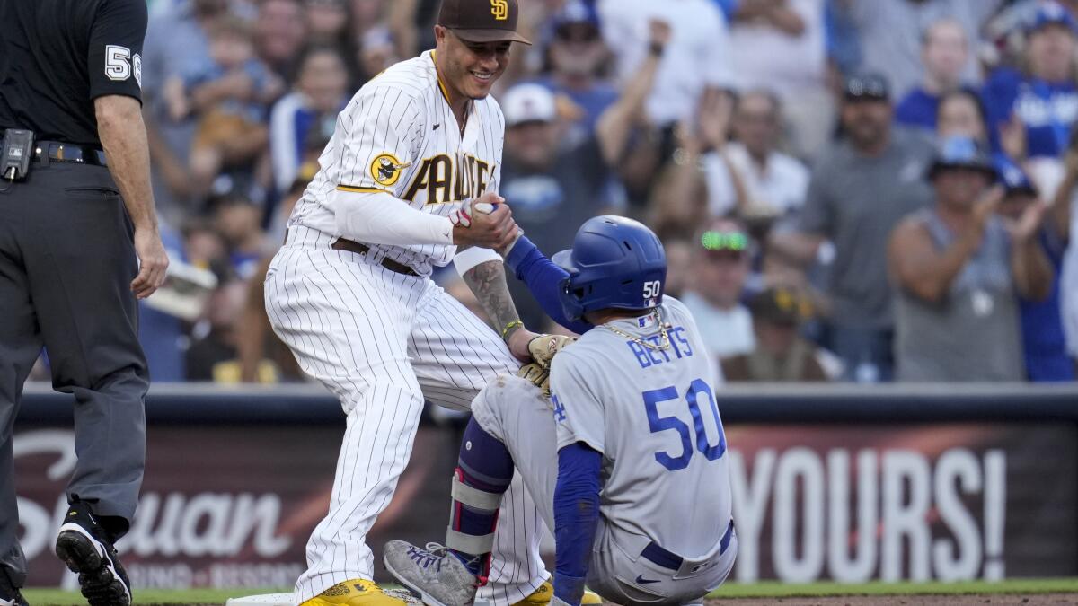 San Diego Padres' Manny Machado wears the home run chain after hitting a  solo home run during the second inning of a baseball game against the Miami  Marlins, Sunday, July 25, 2021