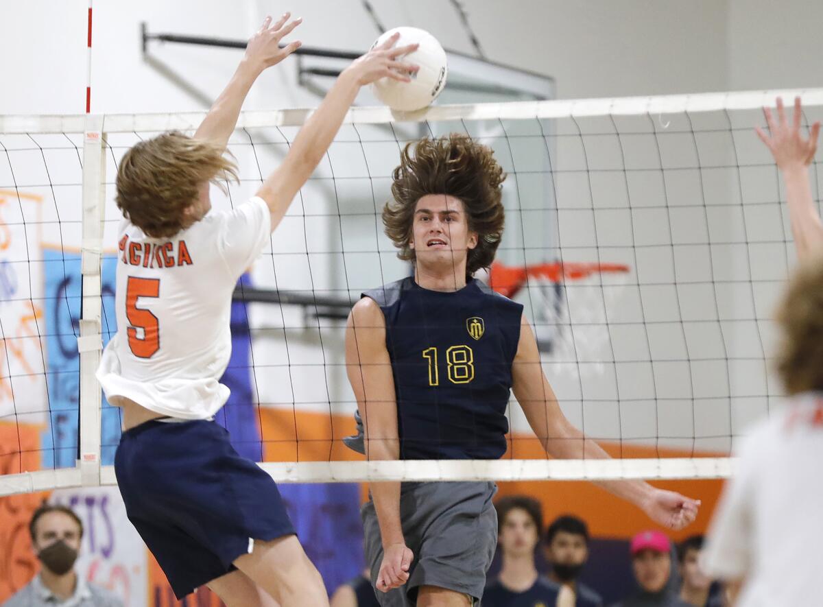 Marina's Aiden Patterson (18) hits a ball against Danny Dillon of Pacifica Christian during a CIF Division 4 quarterfinal.