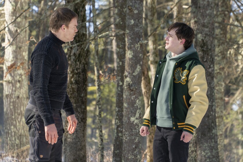 A man is confronted by his son in a snowy wood