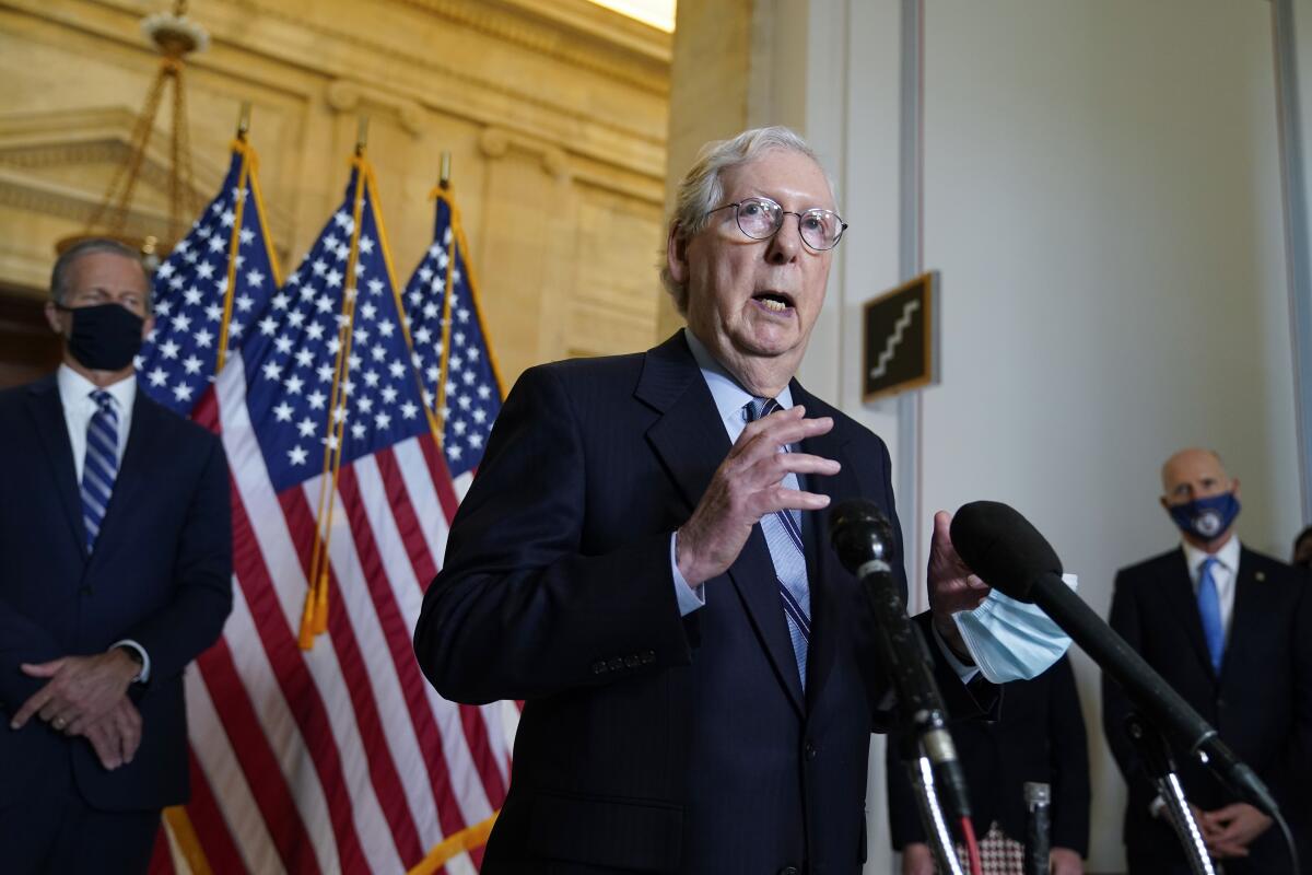 Senate Minority Leader Mitch McConnell (R-Ky.) speaks to reporters April 20 on Capitol Hill.