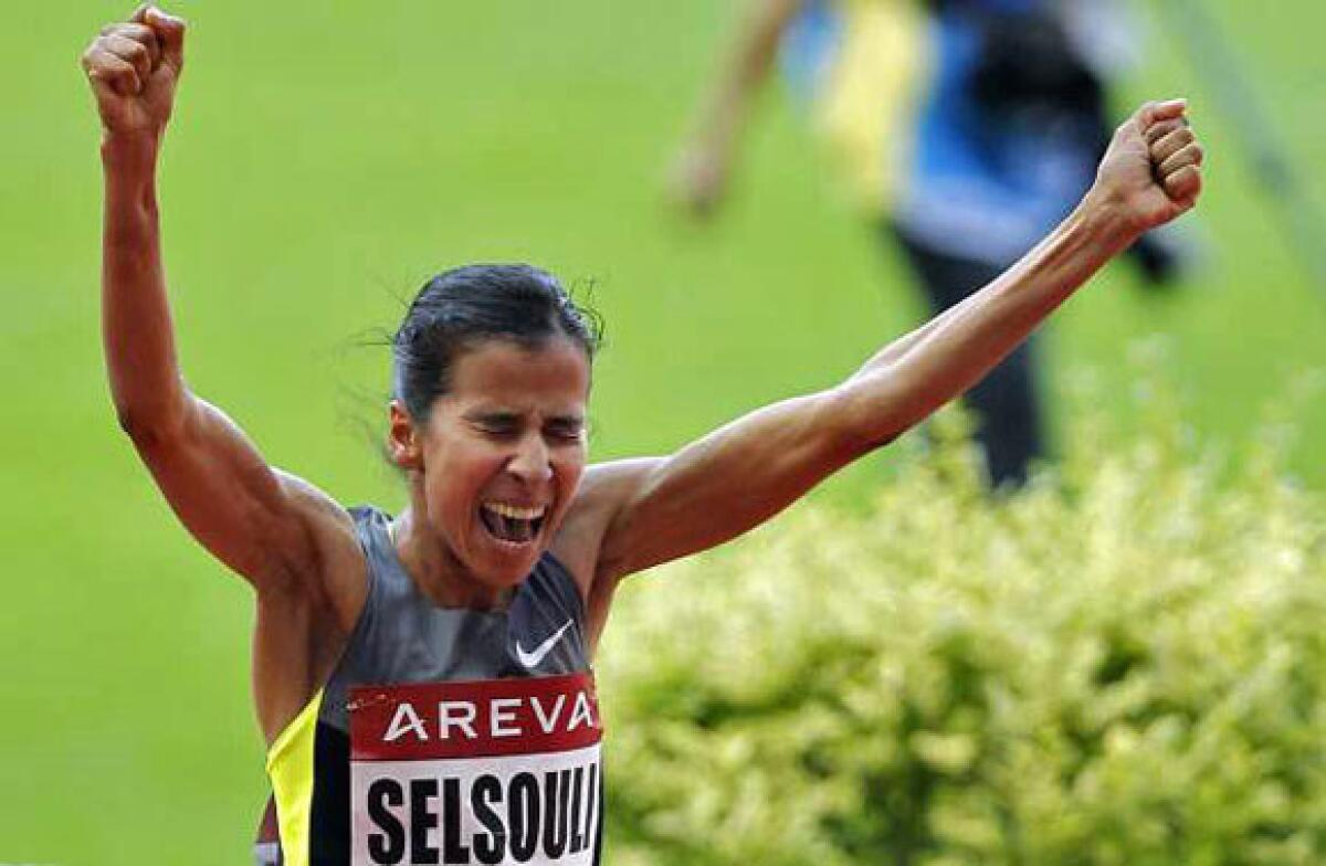 Mariem Alaoui Selsouli of Morocco celebrates after winning the women's 1,500-meter race during the IAAF Diamond League meet at the Stade de France on July 6.