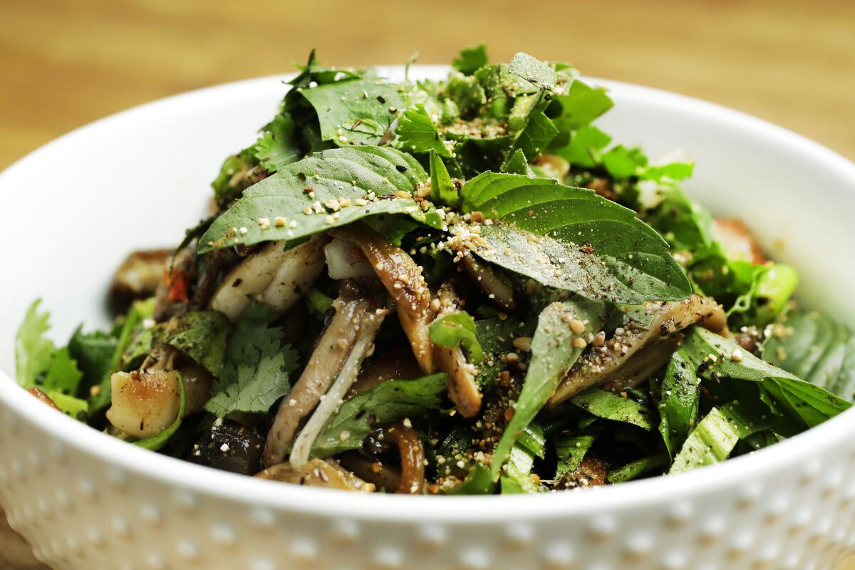 Mushroom larb with fermented fish paste, herbs, mushrooms and toasted rice powder