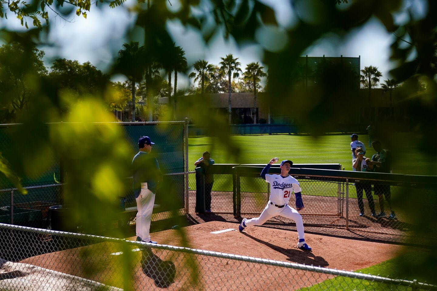 Dodgers starter Walker Buehler works in the bullpen during a spring training workout at Camelback Ranch.