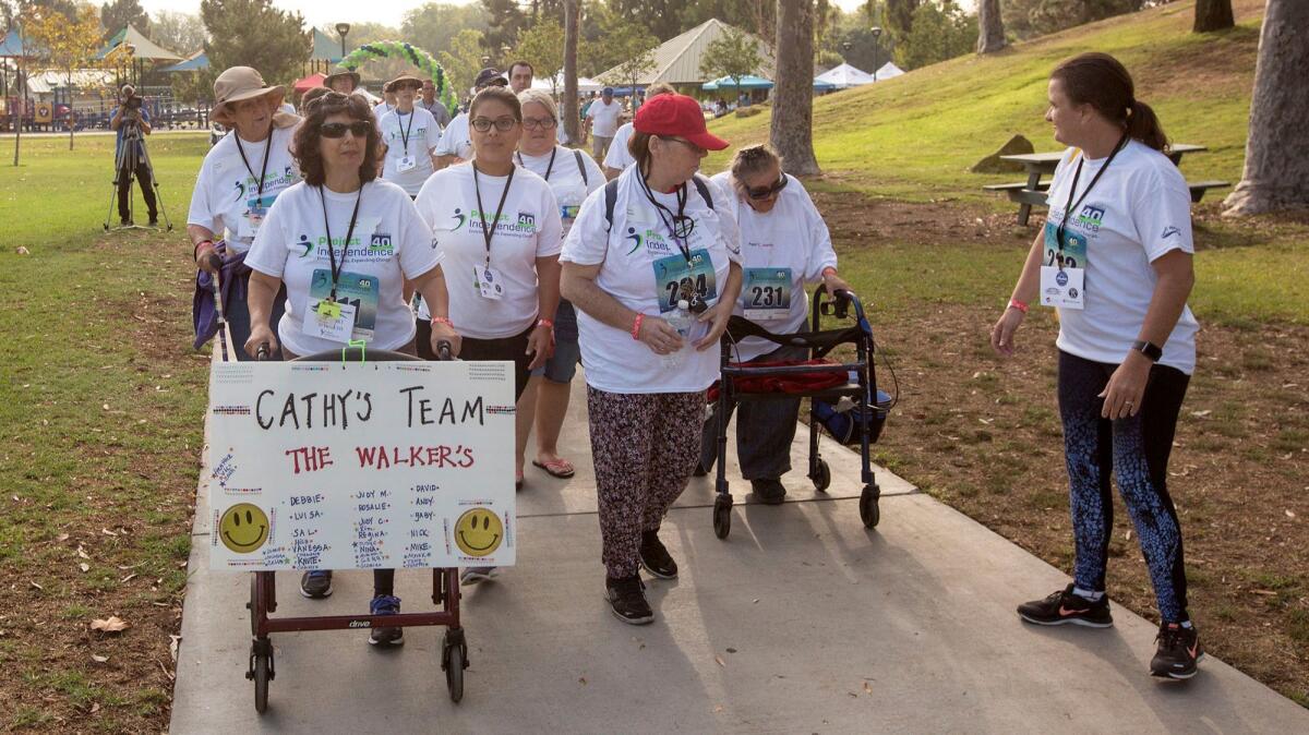 Members of Team Cathy participate in Project Independence's 8th Annual Walk for Independence at TeWinkle Park in Costa Mesa on Saturday, Sept. 9.