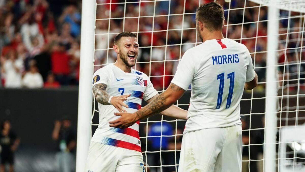 Paul Arriola, left, and Jordan Morris of the U.S. celebrate Arriola's goal in the Americans' 6-0 victory over Trinidad and Tobago in the CONCACAF Gold Cup on Saturday night in Cleveland.