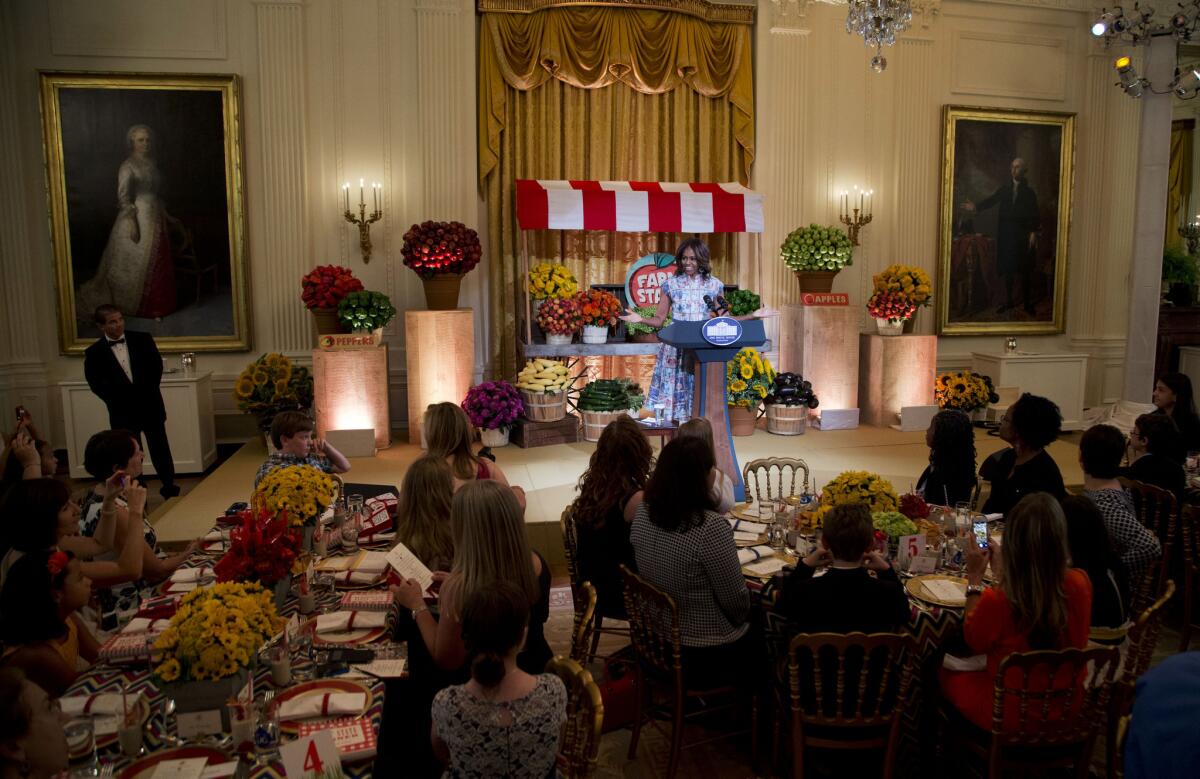 First Lady Michelle Obama speaks at her "Kids' State Dinner" in the East Room of the White House in Washington.